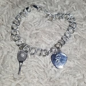 Silver charm bracelet with 2 charms